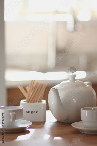 cup, tea, coffee, drink, white, teapot, table, beverage, breakfast, cafe, hot, mug, saucer, food, morning, spoon, espresso, restaurant, pot, kitchen, plate, tableware, brown, cups, cup, tea, drink,