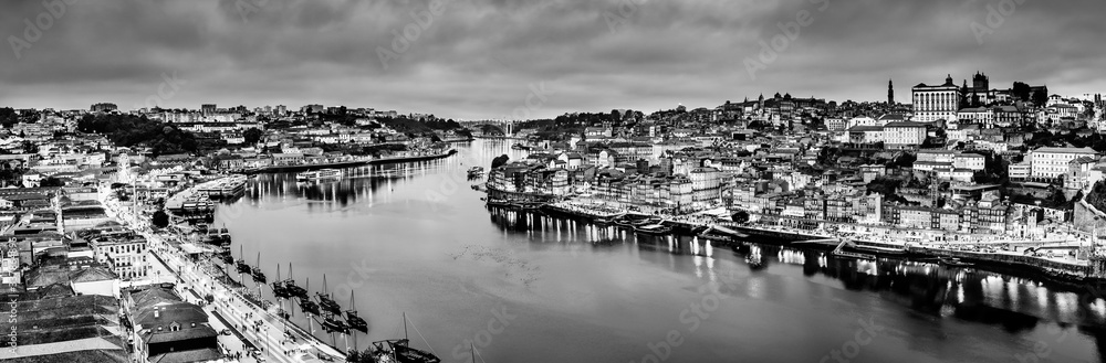 Black and white night cityscape panorama skyline of Porto old town, Luis I Bridge and river Douro banks with reflections. Black and white night cityscape panorama skyline of Porto old town, Luis I Bridge and river Douro banks with reflections.
