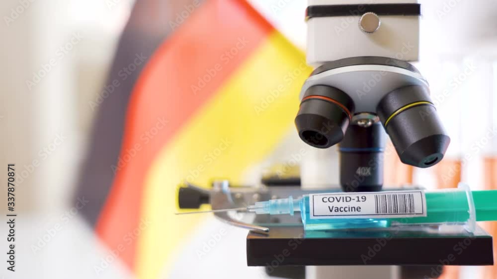 A waving Belgium flag on the back of the Covid-19 vaccine for coronavirus A waving Belgium flag on the back of the Covid-19 vaccine for coronavirus