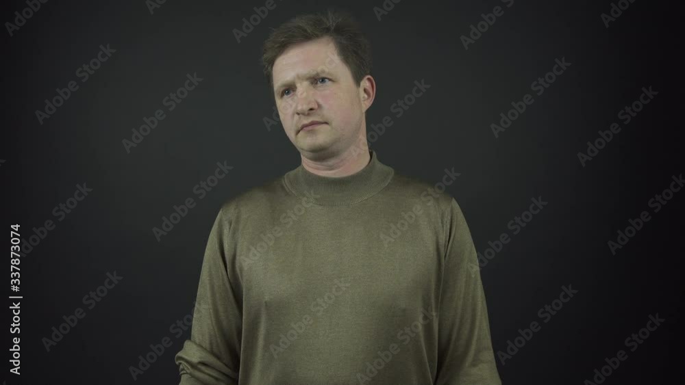 professional actor in brown pullover performs shock emotions professional actor in brown pullover performs shock emotions