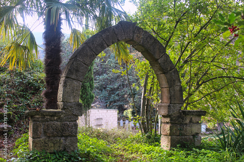 half arco of stone mediaval in park