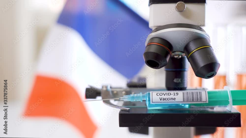 A microscope with the Covid-19 vaccine for coronavirus treatment A microscope with the Covid-19 vaccine for coronavirus treatment