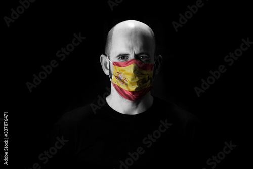 man covered with mask printed the flag of his country.. © David San Segundo