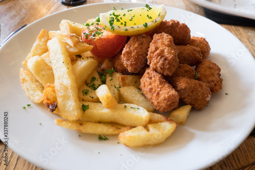 Deep fried scamp and chips pub meal in England