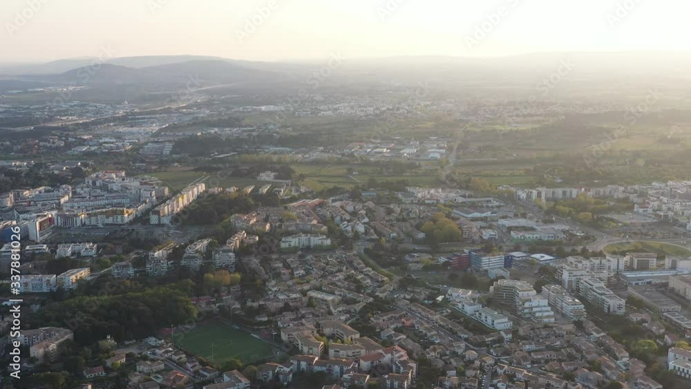 Montpellier large aerial view, calm neighborhood, backlight and misty. Montpellier large aerial view, calm neighborhood, backlight and misty.