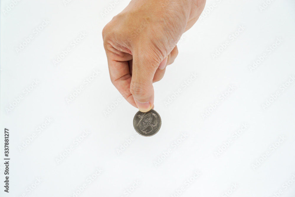 hand holding a coin hand holding a coin