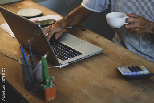 Принти на полотні Asian man working from hone online because of covid-19