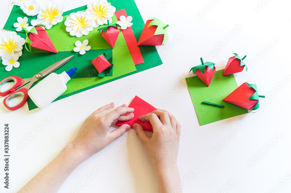 Origami strawberry made of craft paper. Learning at home. Kid diy. Origami strawberry made of craft paper. Learning at home. Kid diy.