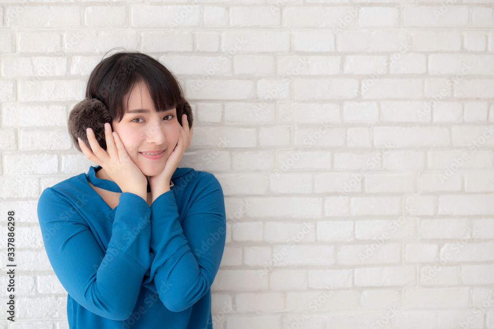 Portrait of beautiful young asian woman enjoy and happiness standing on gray cement texture grunge wall brick background, girl is a smiling and cheerful on concrete. Portrait of beautiful young asian woman enjoy and happiness standing on gray cement texture grunge wall brick background, girl is a smiling and cheerful on concrete.