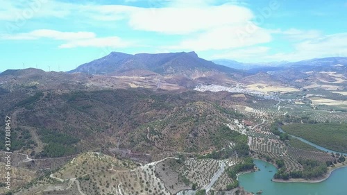 Beautiful aerial view of Andalusia , South of Spain landscape. Mountains, hills, agriculture and roads. Different colours of field. Typically Andalusian landscape view. Zoom in video