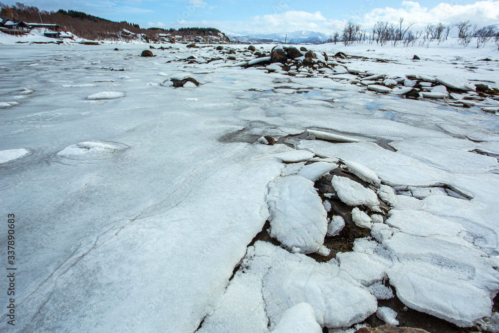 When colder than 4 degree celcius, water expands and becomes less dense then floats to the surface and freezes to form a layer of ice. At shallow water, the ice is broken into small sheets. When colder than 4 degree celcius, water expands and becomes less dense then floats to the surface and freezes to form a layer of ice. At shallow water, the ice is broken into small sheets.