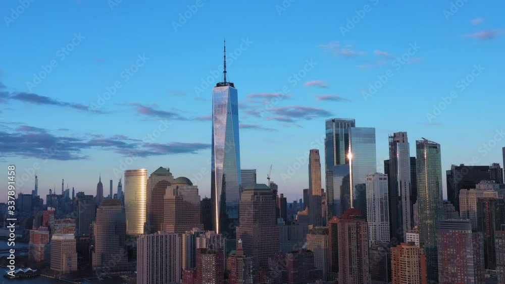 Dolly out aerial freedom tower skyline; slow and cinematic Dolly out aerial freedom tower skyline; slow and cinematic
