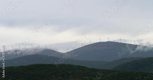 Mindmills on the top of hills in the plains, clean and sustainable energy. photo