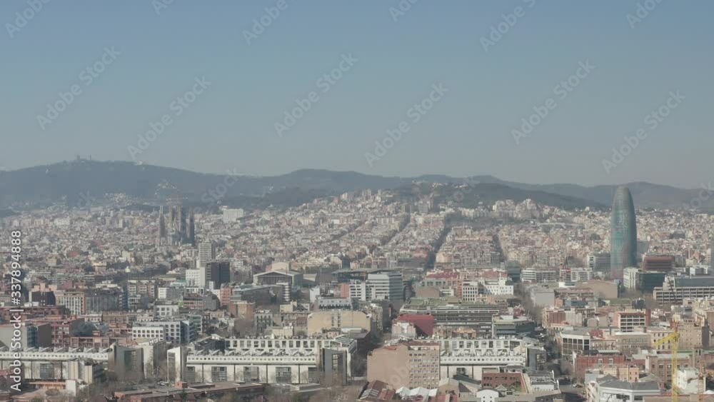 AERIAL: Barcelona Wide Drone Shot of City Towards Center with La Sagrada Familia and Torre Glories, Torre Agbar AERIAL: Barcelona Wide Drone Shot of City Towards Center with La Sagrada Familia and Torre Glories, Torre Agbar