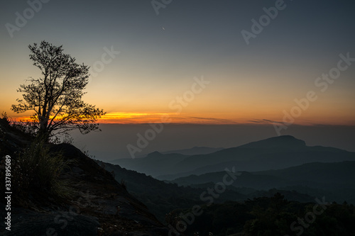 Twilight and morning sun at a viewpoint in the mountains of northern Thailand on a new day