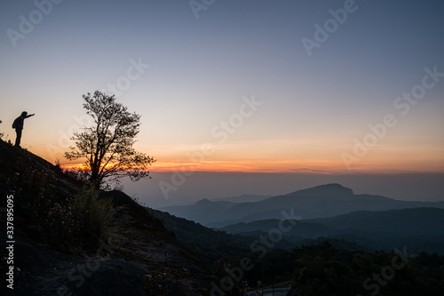 Twilight and morning sun at a viewpoint in the mountains of northern Thailand on a new day