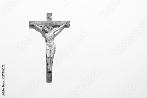 Fotografering Jesus Christ On Cross Against White Background