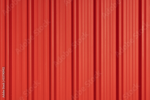The red metal sheet with sun light. Free copy space.