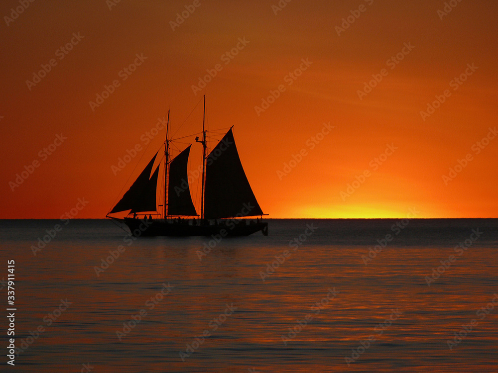 A pearl lugger at sunset off Cable Beach