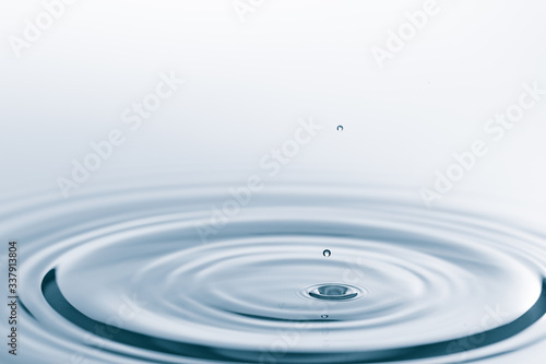 Waves on the surface of the water from a collision. Drop of water drop to the surface.