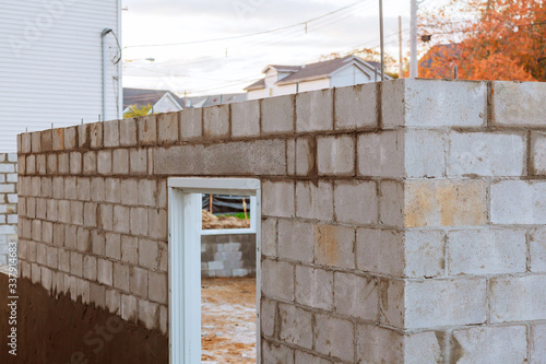 Founding a house raw wall without plaster with concrete in masonry bricklaying