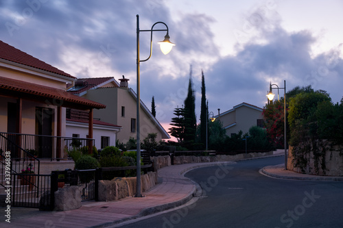 The view of the street of Pissouri village in the evening light. Limassol district. Cyprus