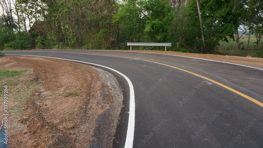 Asphalt road and countryside views Asphalt road and countryside views