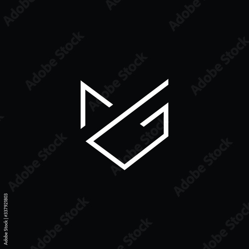 Minimal elegant monogram art logo. Outstanding professional trendy awesome artistic MG GM initial based Alphabet icon logo. Premium Business logo White color on black background