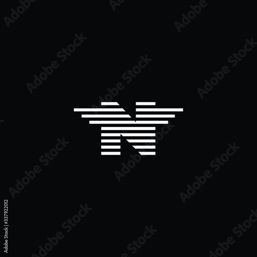 Minimal elegant monogram art logo. Outstanding professional trendy awesome artistic N initial based Alphabet icon logo. Premium Business logo White color on black background