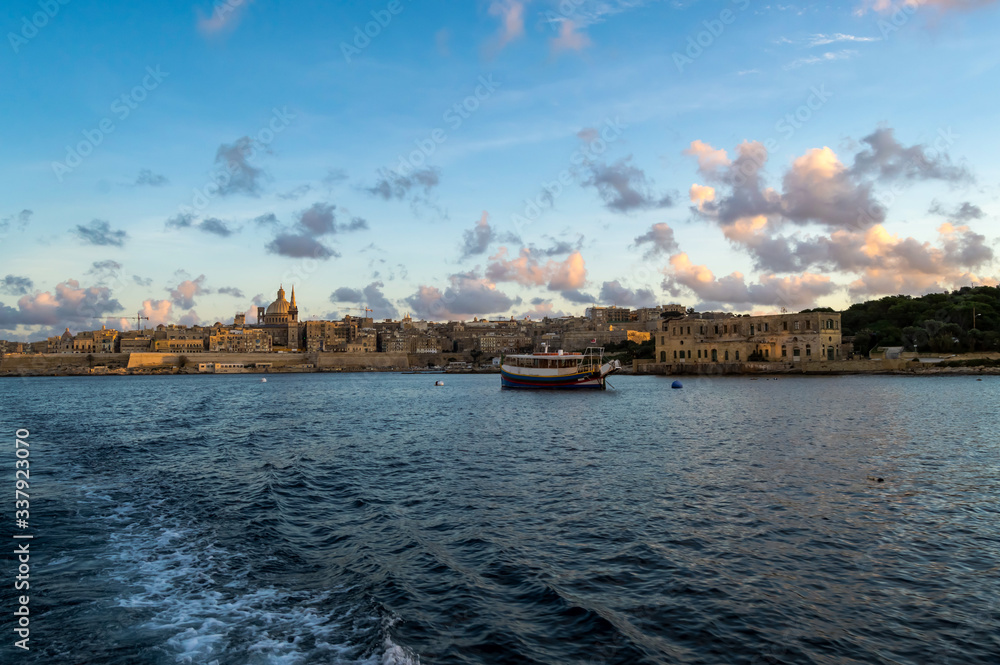Panoramic view of Valletta Skyline at beautiful sunset from Sliema