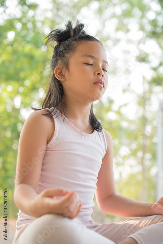 calmness and relax, female happiness.Horizontal, blurred background. little asian girl meditates while practicing yoga. freedom concept. calmness and relax, child happiness. toned picture healthy life Free Download calmness and relax, female happiness.Horizontal, blurred background. little asian girl meditates while practicing yoga. freedom concept. calmness and relax, child happiness. toned picture healthy life - GFXLoad