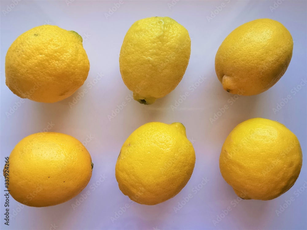 Lemons. 6 whole lemons on a white background. Top view. Fresh vitamin nutrition. Natural food. Isolated citrus fruit set