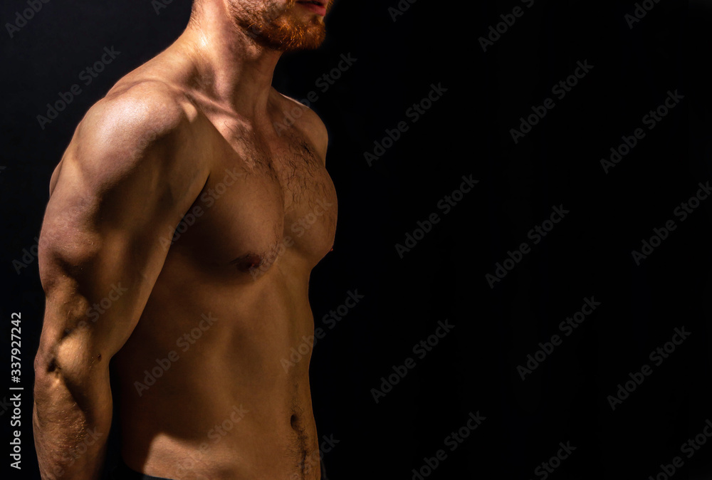 Trained body of a man on a dark background