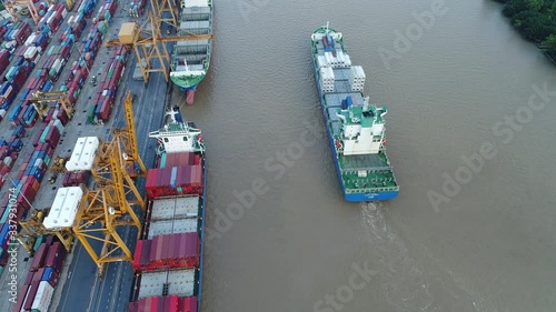 Aerial view of cargo ship, cargo container in warehouse harbor at thailand, container ship in import export and business logistic with sunset