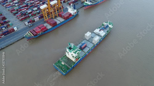 Aerial view of cargo ship, cargo container in warehouse harbor at thailand, container ship in import export and business logistic with sunset