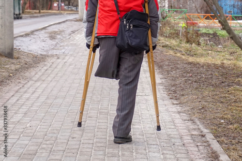  One leg and two crutches - disability concept.