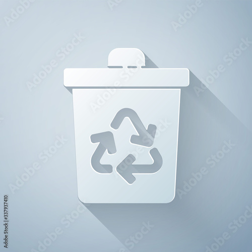 Paper cut Recycle bin with recycle symbol icon isolated on grey background. Trash can icon. Garbage bin sign. Recycle basket sign. Paper art style. Vector Illustration