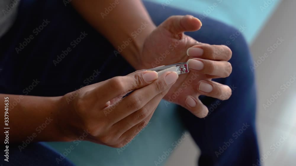 nail hand clipper at home. close up of nail being cut clean nail hand clipper at home. close up of nail being cut clean