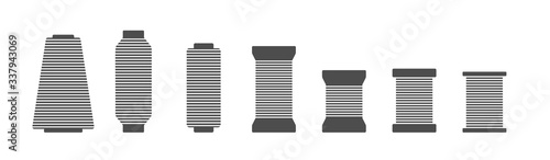 Spool and bobbin silhouette icon set vector illustration. Black bobbin silhouette with outline needle isolated on white background. Machinery spool instrument, fashion logo, tailor craft equipment