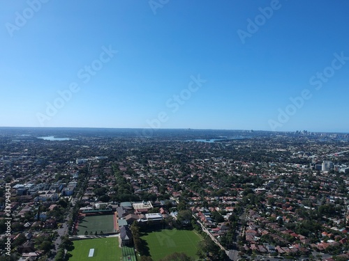 Fototapeta Naklejka Na Ścianę i Meble -  Drone panoramic aerial view of Sydney NSW Australia city Skyline and looking down on all suburbs 