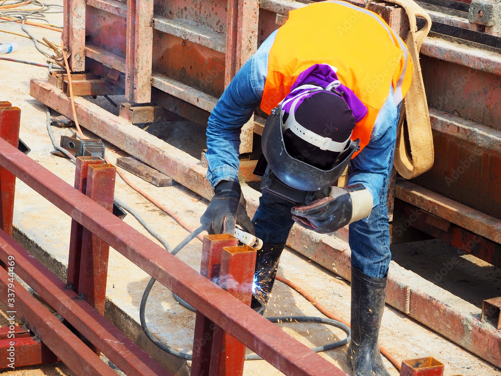 Welding work ,worker with protective welding metal on construction Welding work ,worker with protective welding metal on construction