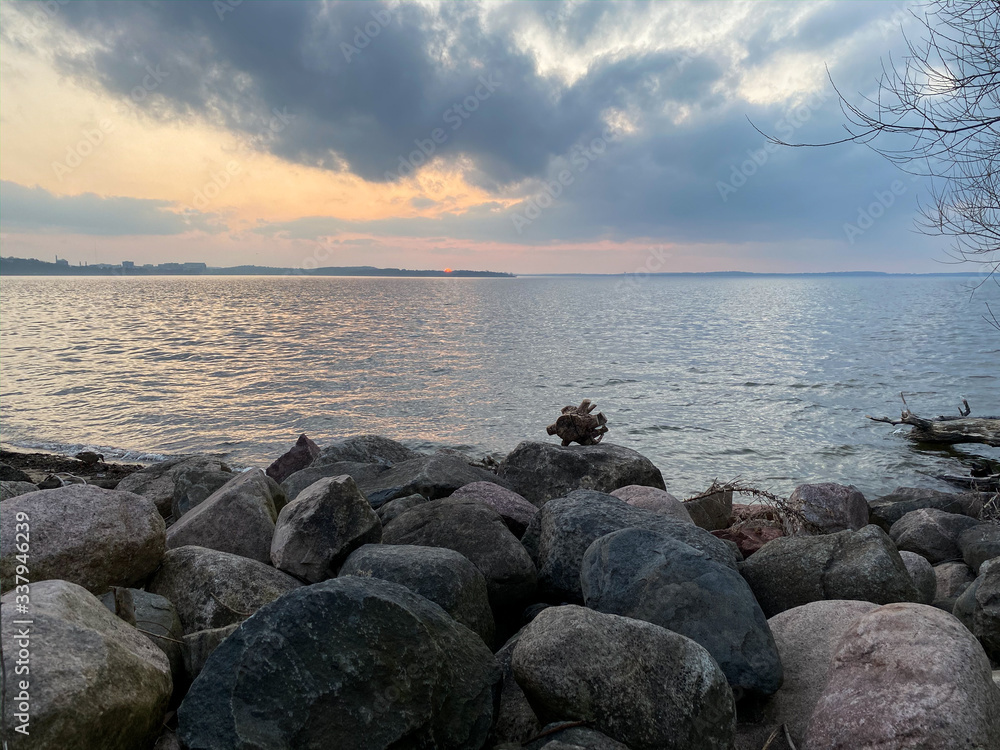 pink sunset over lake piers rocks hanging tree pink sunset over lake piers rocks hanging tree