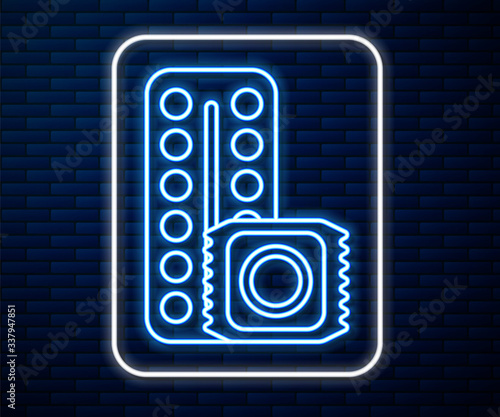 Glowing neon line Packaging of birth control pills and condom in package safe sex icon isolated on brick wall background. Contraceptive pill. Vector Illustration