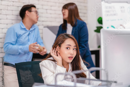 Принти на полотні Asian Business woman be curious and listening the couple talking about lovers pr