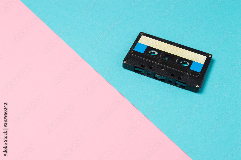 Fototapeta premium Retro audio cassette tapes on colorful background. Vintage music technology concept.
