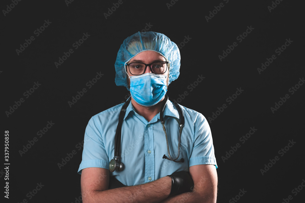 Medical doctor, nurse, surgeon, psychologist working with protective mask, glasses and gloves helping people in the days of panic, pandemic - studio shot on black background. Medical doctor, nurse, surgeon, psychologist working with protective mask, glasses and gloves helping people in the days of panic, pandemic - studio shot on black background.