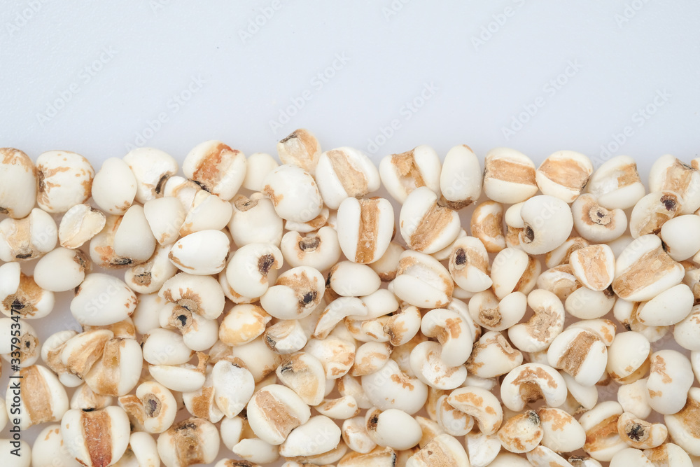 millet in a wooden bowl isolated on white millet in a wooden bowl isolated on white