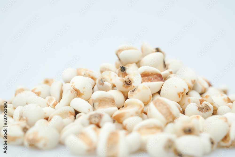 millet in a wooden bowl isolated on white millet in a wooden bowl isolated on white