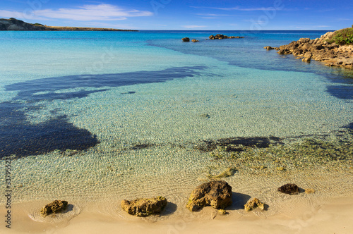 The most beautiful sandy beaches of Apulia: Marina di Pulsano (Italy).  The coast is characterized by a alternation of sandy coves and jagged cliffs overlooking a truly clear and crystalline sea.