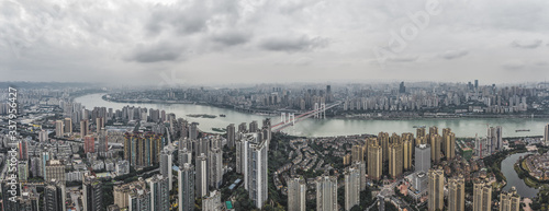 Aerial pano pano drone shot of populated residence buildings alng Yangtze river in Chongqing, southwest China metropolis